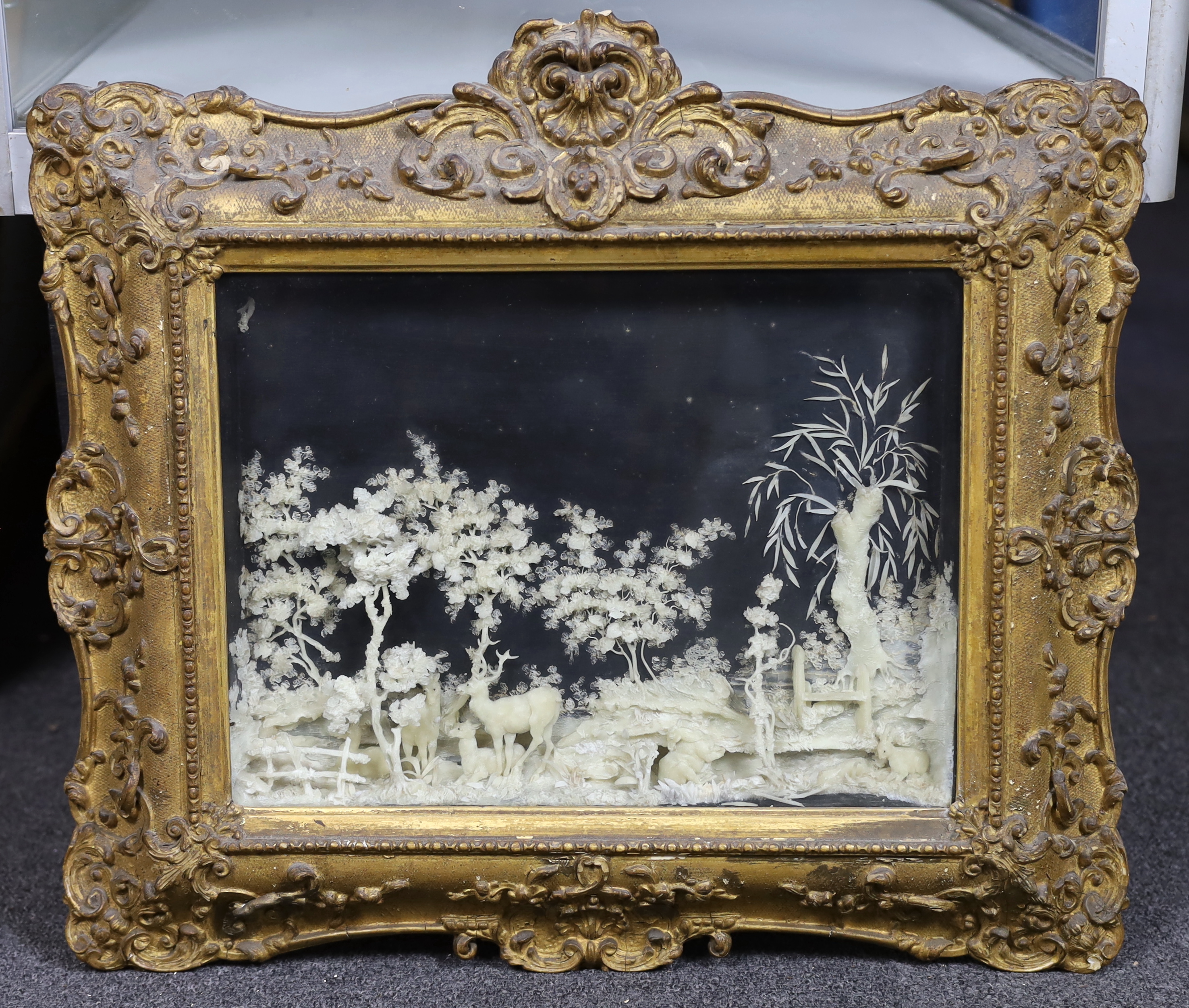 A rare pair of mid 19th century carved wax pictures, 26 x 36cm, original gilt gesso frames